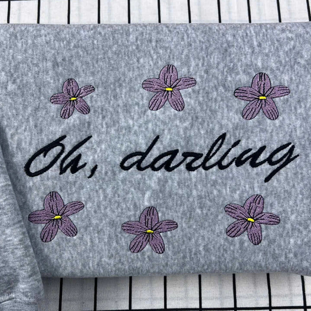 Bookish Oh, Darling embroidered crewneck sweatshirt, romantasy style, Powerless inspired, ideal for fans of Lauren Roberts books.

