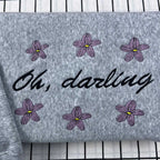 Bookish Oh, Darling embroidered crewneck sweatshirt, romantasy style, Powerless inspired, ideal for fans of Lauren Roberts books.

