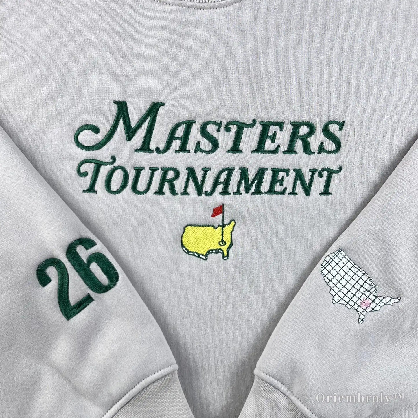 Old money golf aesthetic cream sweatshirt with detailed Masters embroidery and USA map sleeve patches. A perfect preppy country club style pullover for a sophisticated casual look