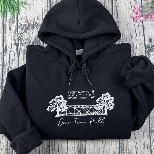One Tree Hill embroidered sweatshirt folded on table