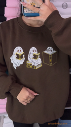 Model wearing an oversized chocolate brown Reading Ghosts embroidered crewneck sweater for autumn reading vibe