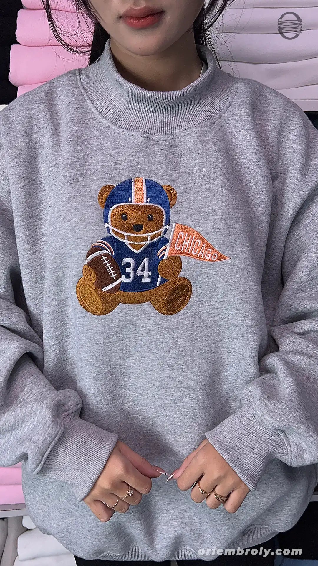 Model wearing an oversized sport grey Chicago football bear number 34 embroidered crewneck sweater for game day outfit