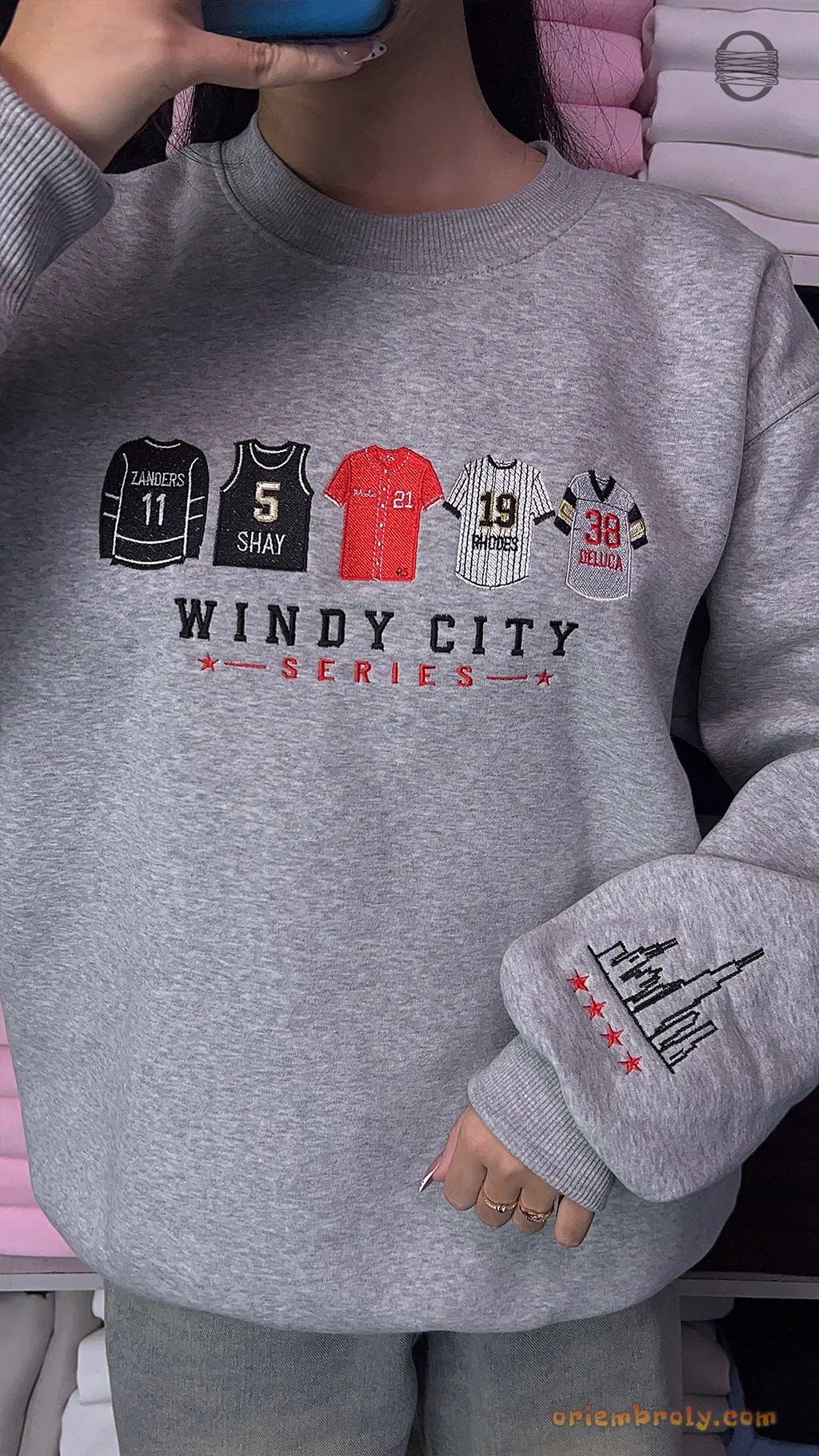 Model wearing an oversized heather grey Windy City Series Chicago sports embroidered crewneck sweater