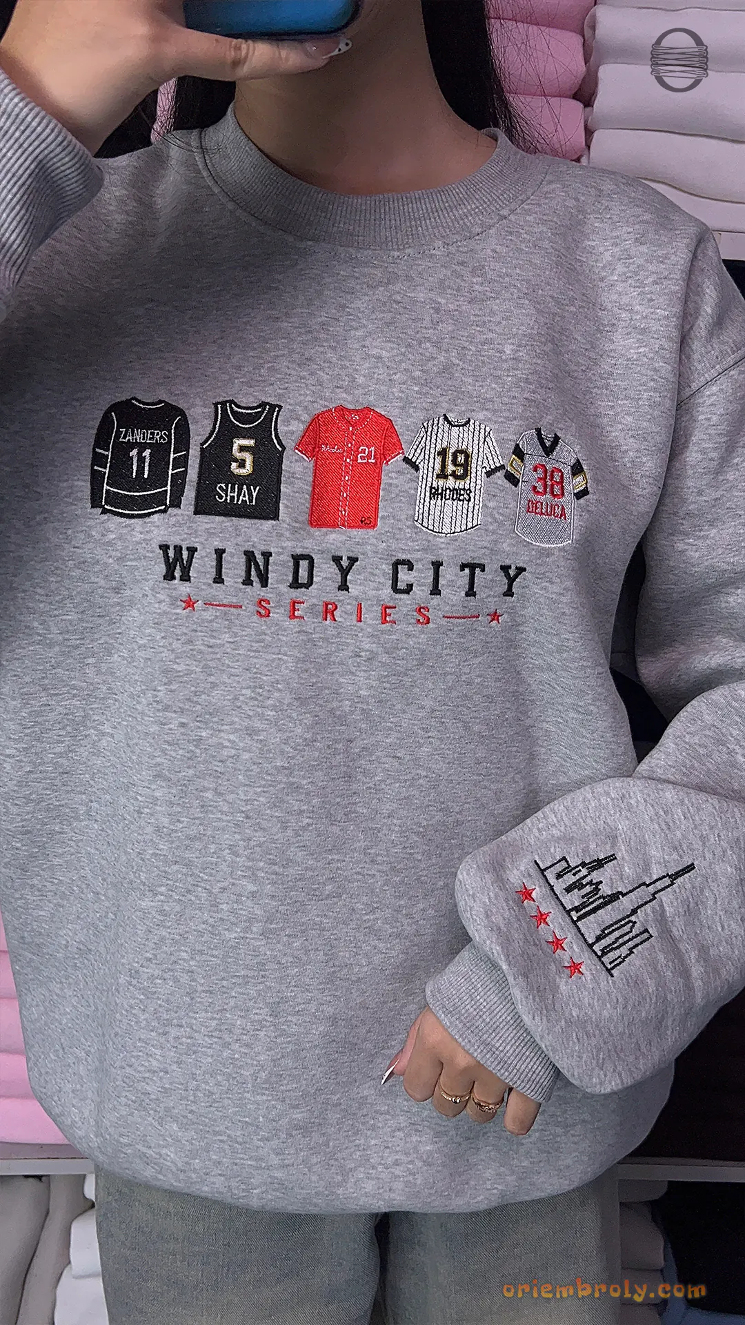 Model wearing an oversized heather grey Windy City Series Chicago sports embroidered crewneck sweater