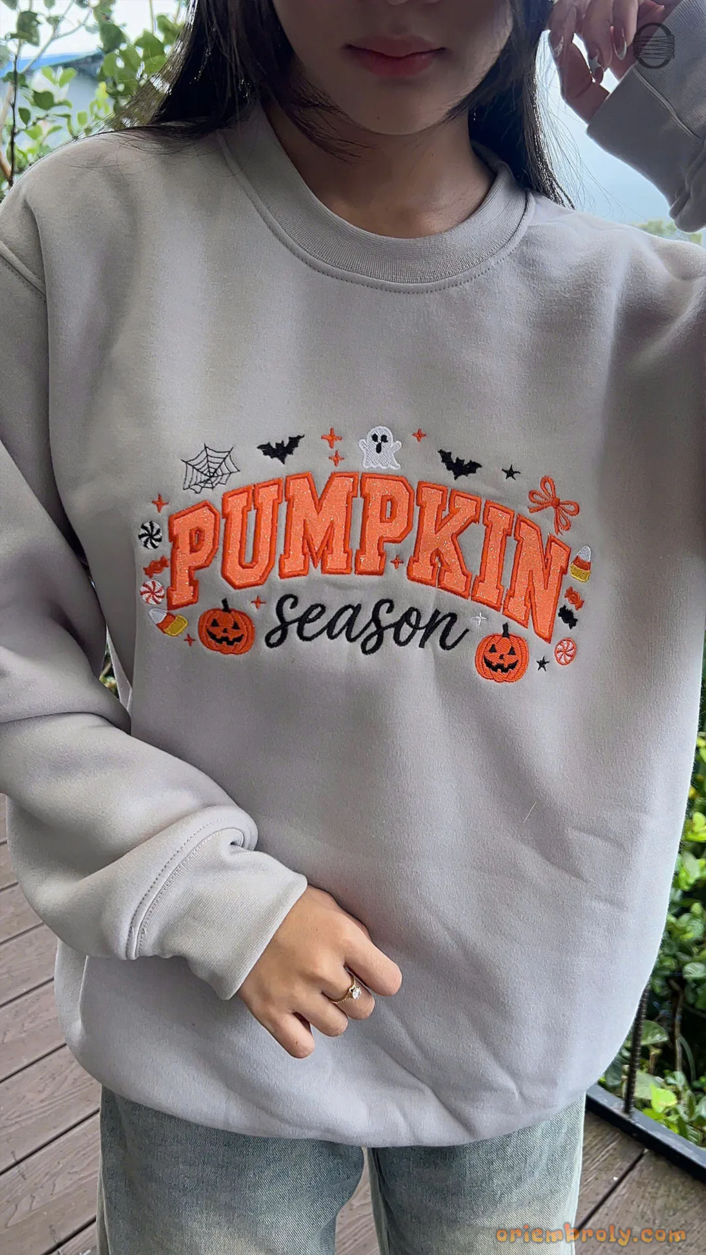 Model wearing an oversized light grey Pumpkin Season embroidered sweatshirt for a cozy autumn outfit