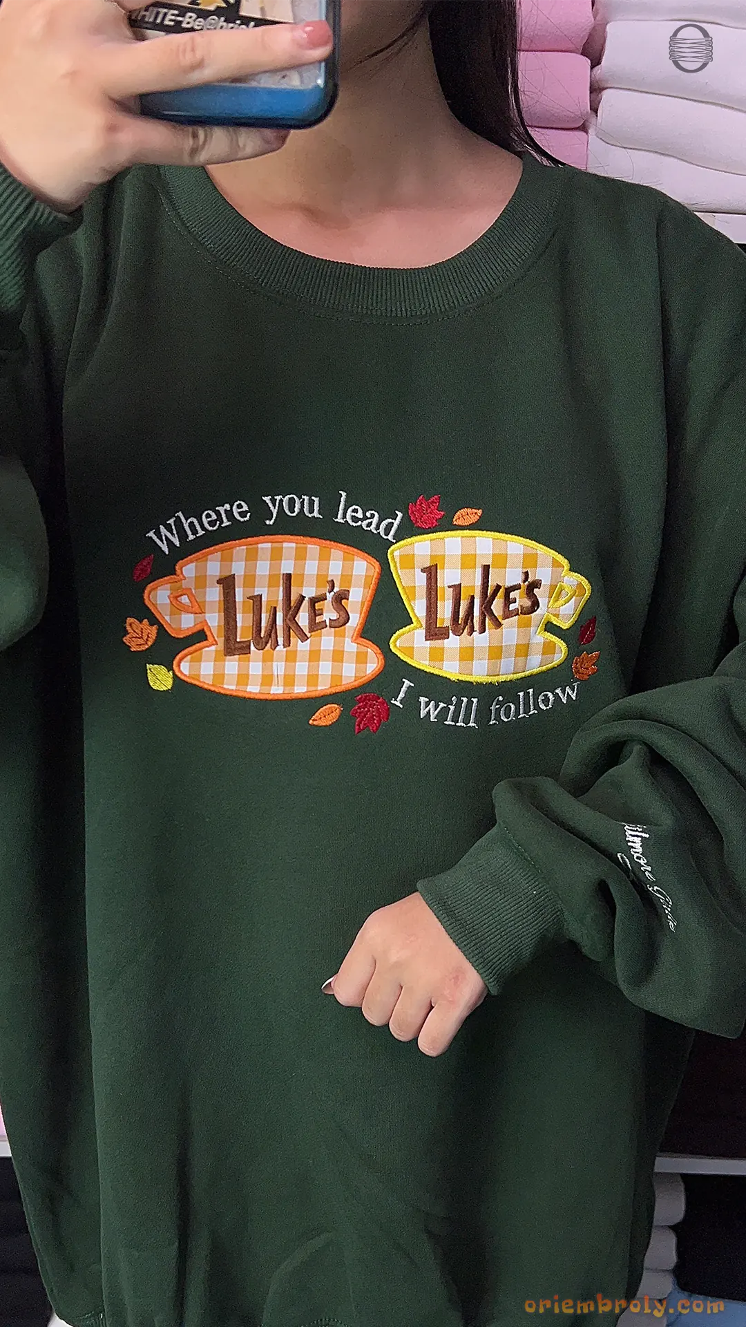 Model wearing an oversized forest green Lukes Diner Where You Lead embroidered sweatshirt for autumn outfit