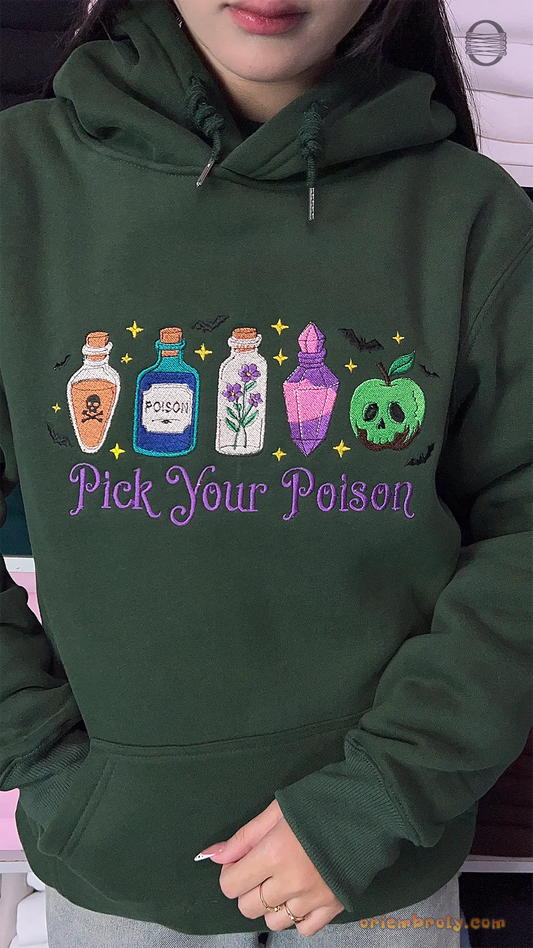 Model wearing an oversized forest green Pick Your Poison embroidered hoodie for spooky season outfit