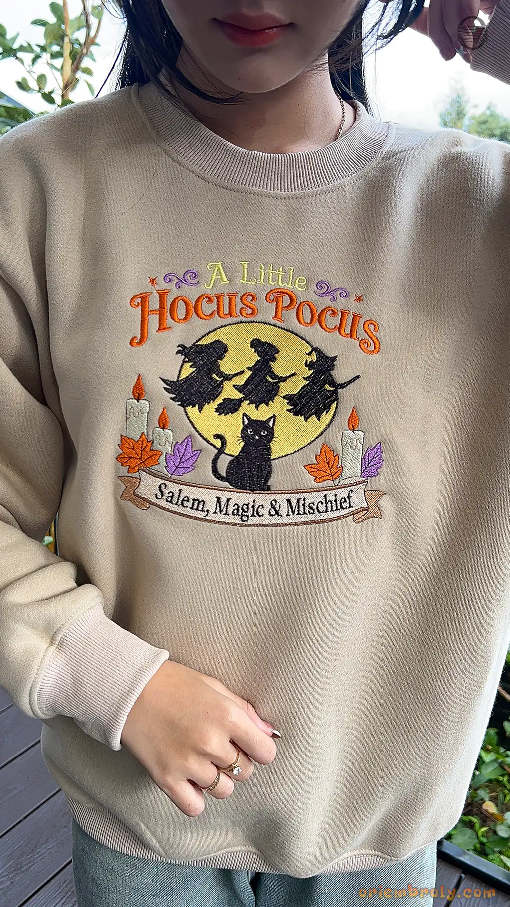 Model wearing an oversized sand beige A Little Hocus Pocus embroidered sweatshirt for Halloween spooky season