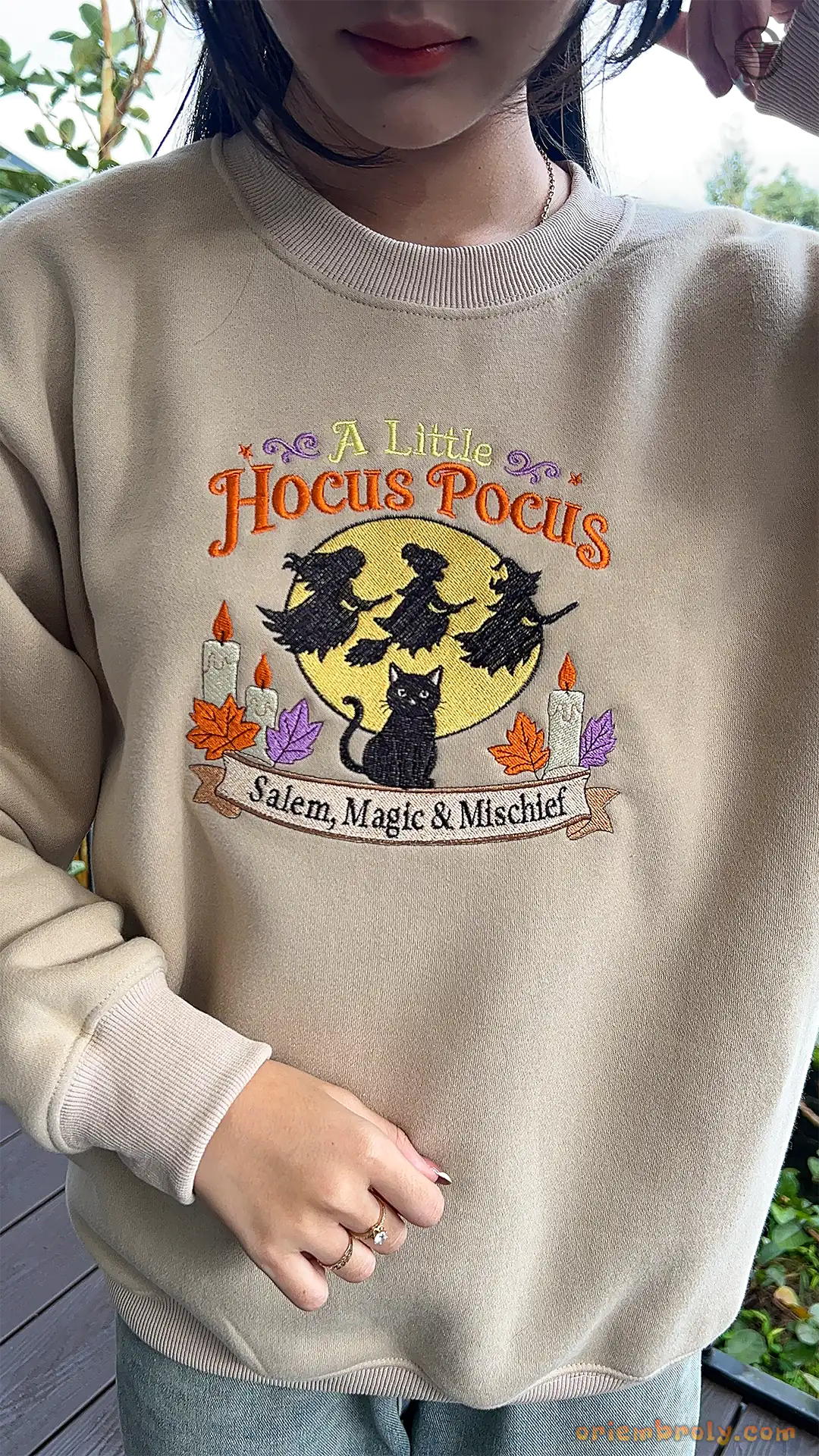 Model wearing an oversized sand beige A Little Hocus Pocus embroidered sweatshirt for Halloween spooky season
