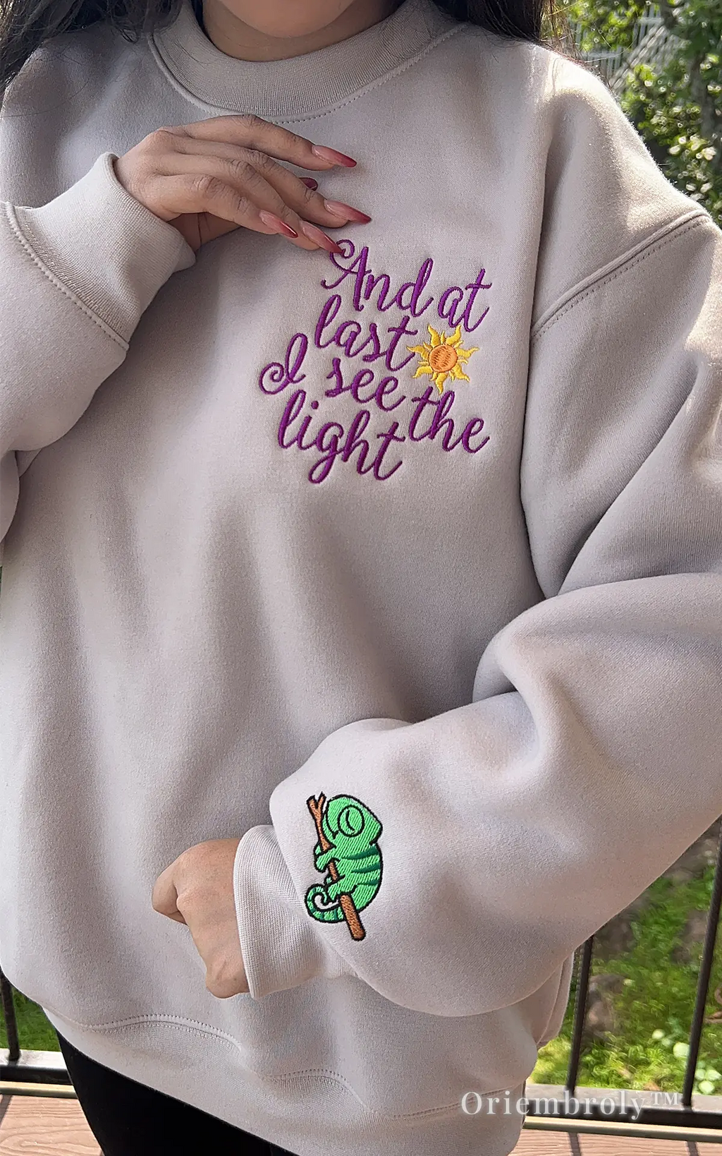 Minimalist Tangled sweatshirt with unique Pascal sleeve embroidery and cursive quote.