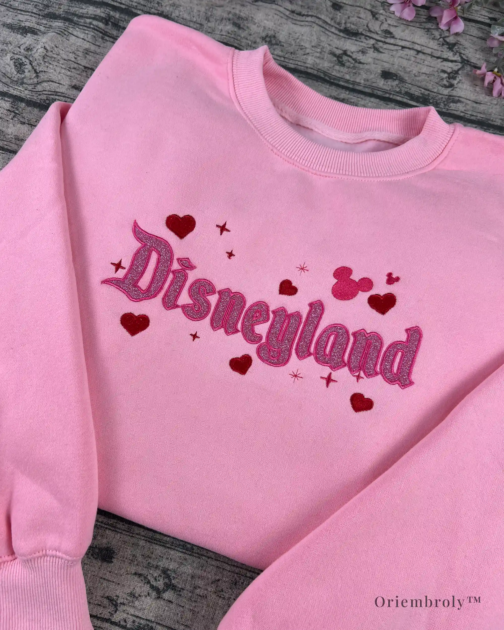 Pastel pink sweatshirt with glitter embroidery, ideal for park lovers, fairytale fans, and magic seekers.