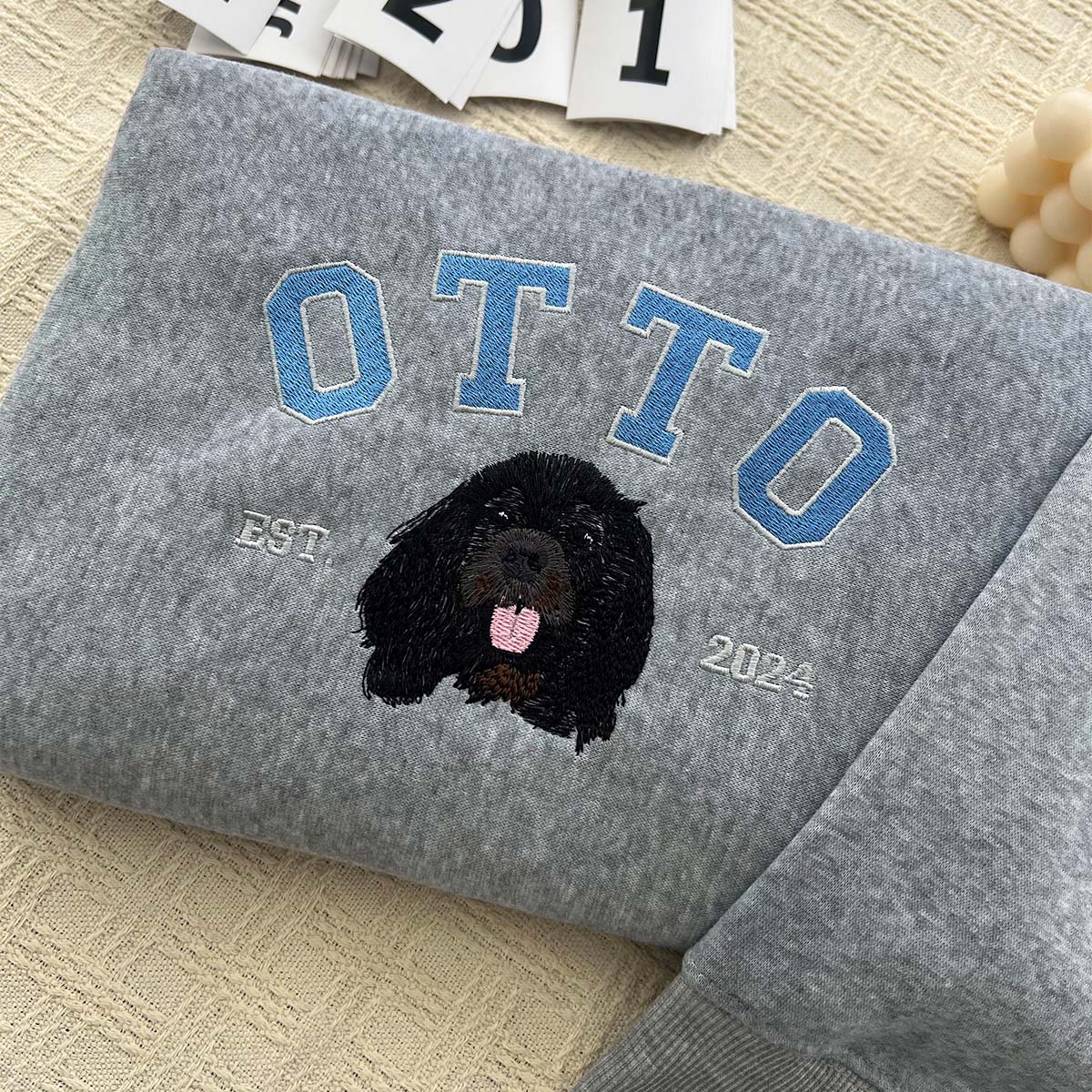 Custom embroidered dog portrait on a soft sweatshirt.