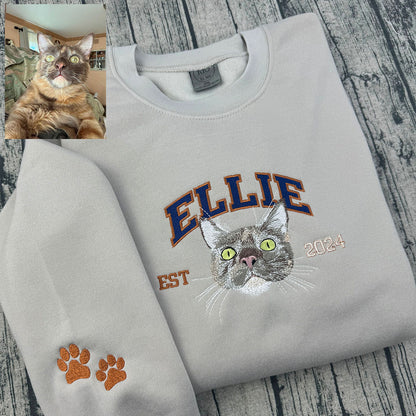 Custom embroidered sweatshirt featuring multiple pet portraits.