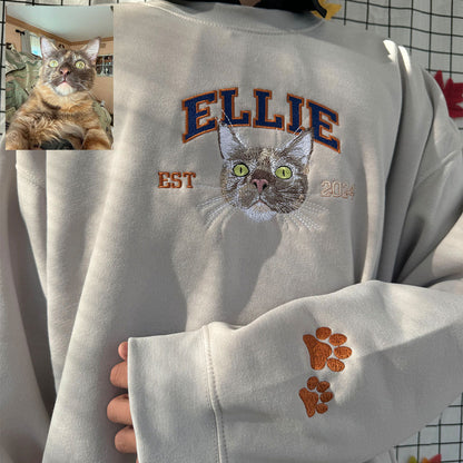 Custom embroidered sweatshirt featuring multiple pet portraits.