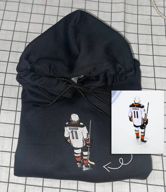 Custom picture embroidered hoodie featuring a unique design