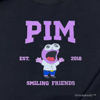 pink wide eyed cartoon embroidery close up
