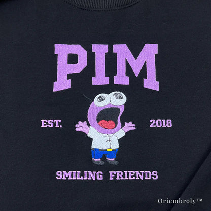 pink wide eyed cartoon embroidery close up