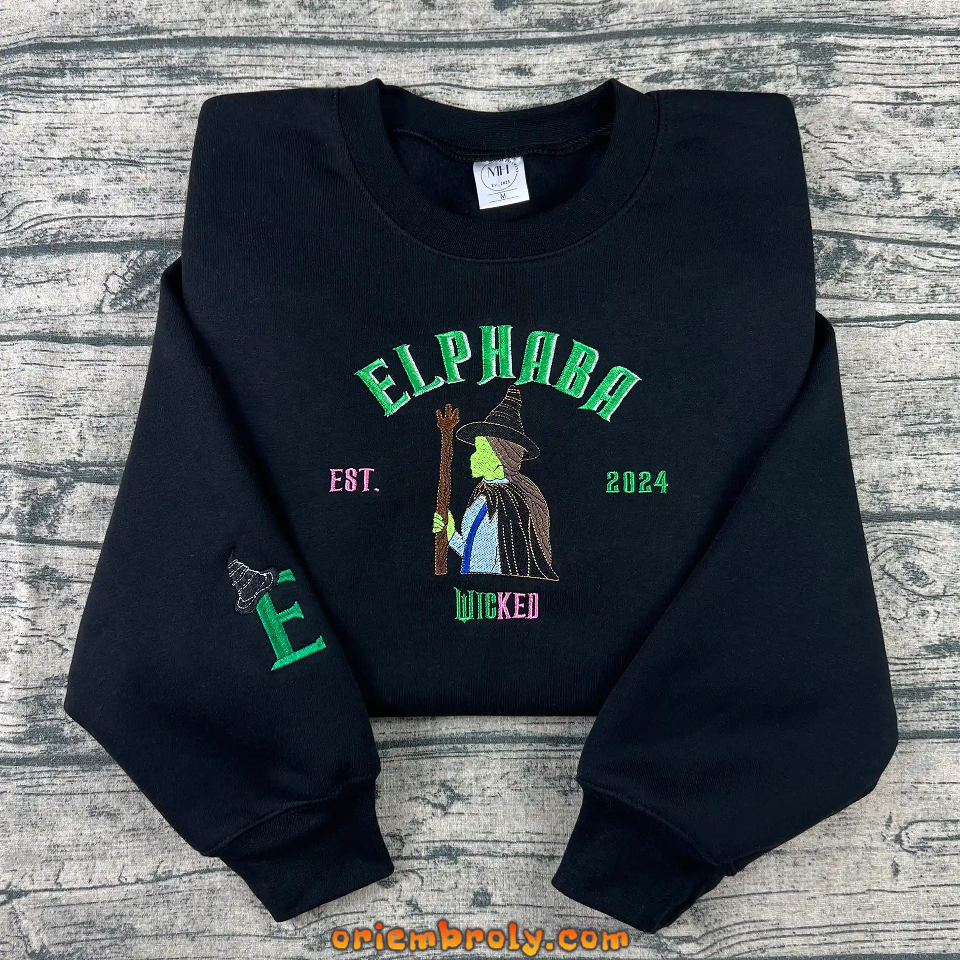 Detailed embroidery of Pink Witch and Green Witch design