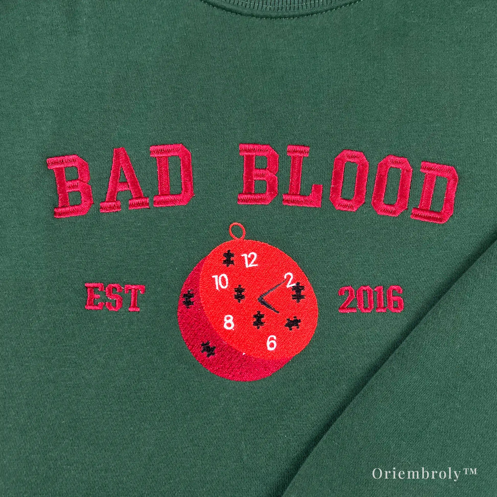 red pocket watch embroidery detail on bookish sweatshirt