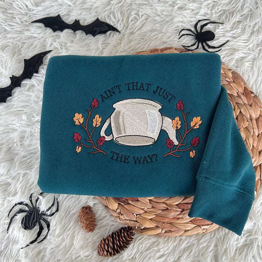 Pottsfield Harvest Festival embroidered sweatshirt with pumpkin skeleton design