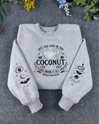 Flat lay of a grey Practical Magic embroidered sweatshirt with Put The Lime In The Coconut text and spooky sleeve embroidery
