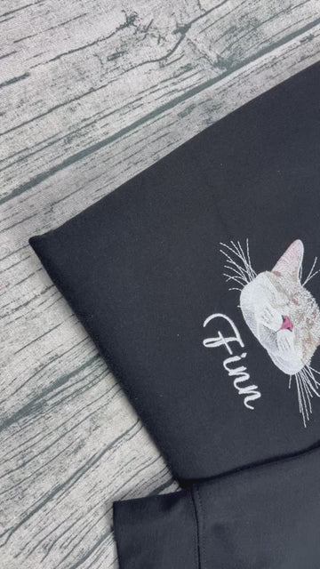 video embroidery - Hand-stitched pet portrait hoodie featuring a custom embroidered dog or cat design.