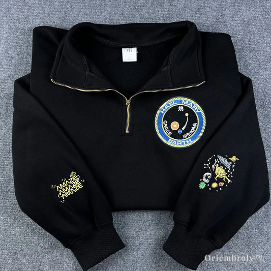 Premium black quarter-zip sweatshirt featuring the Project Hail Mary mission patch and cosmic sleeve embroidery. A high-quality gift for Andy Weir sci-fi fans and book lovers