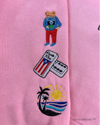 Detailed embroidered patches on Benito Bowl sweatshirt
