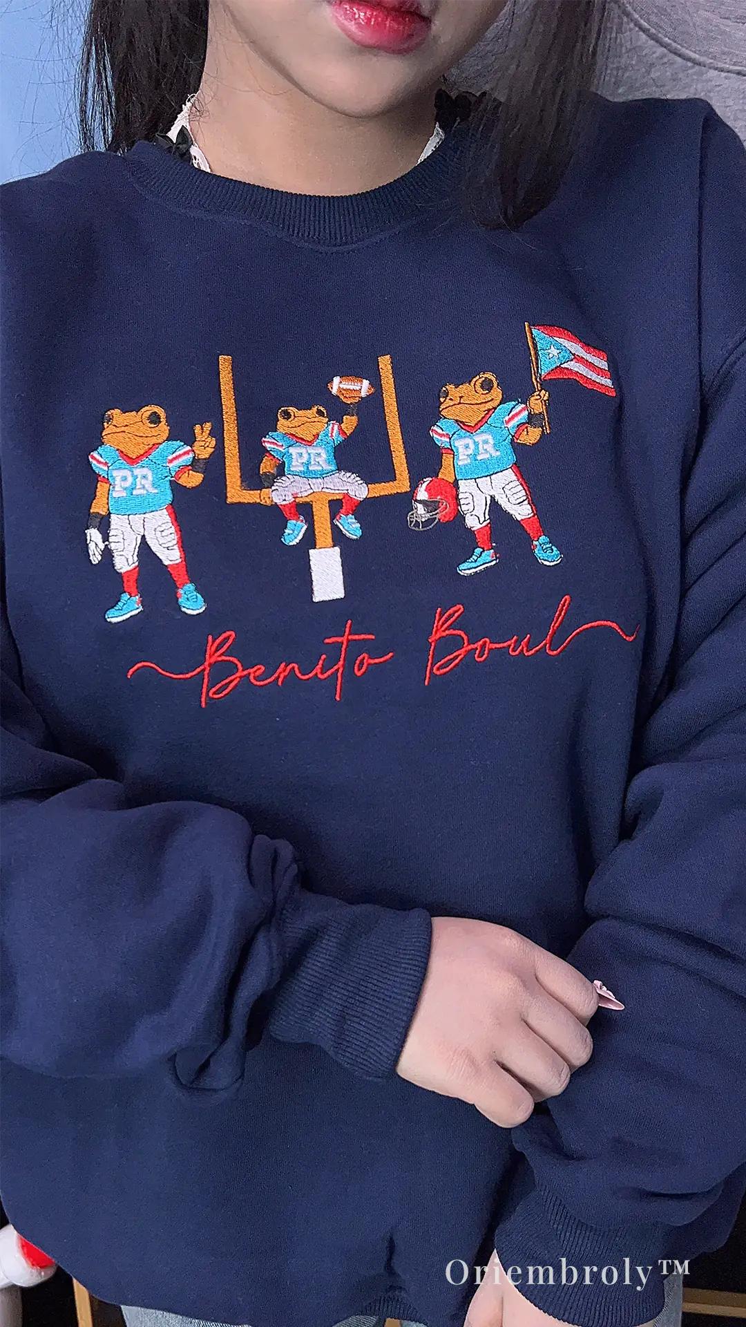 Puerto Rico fan wearing embroidered crewneck sweatshirt