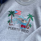 Gray sweatshirt with a Puerto Rico-themed design featuring a bear, palm trees, and a flag.