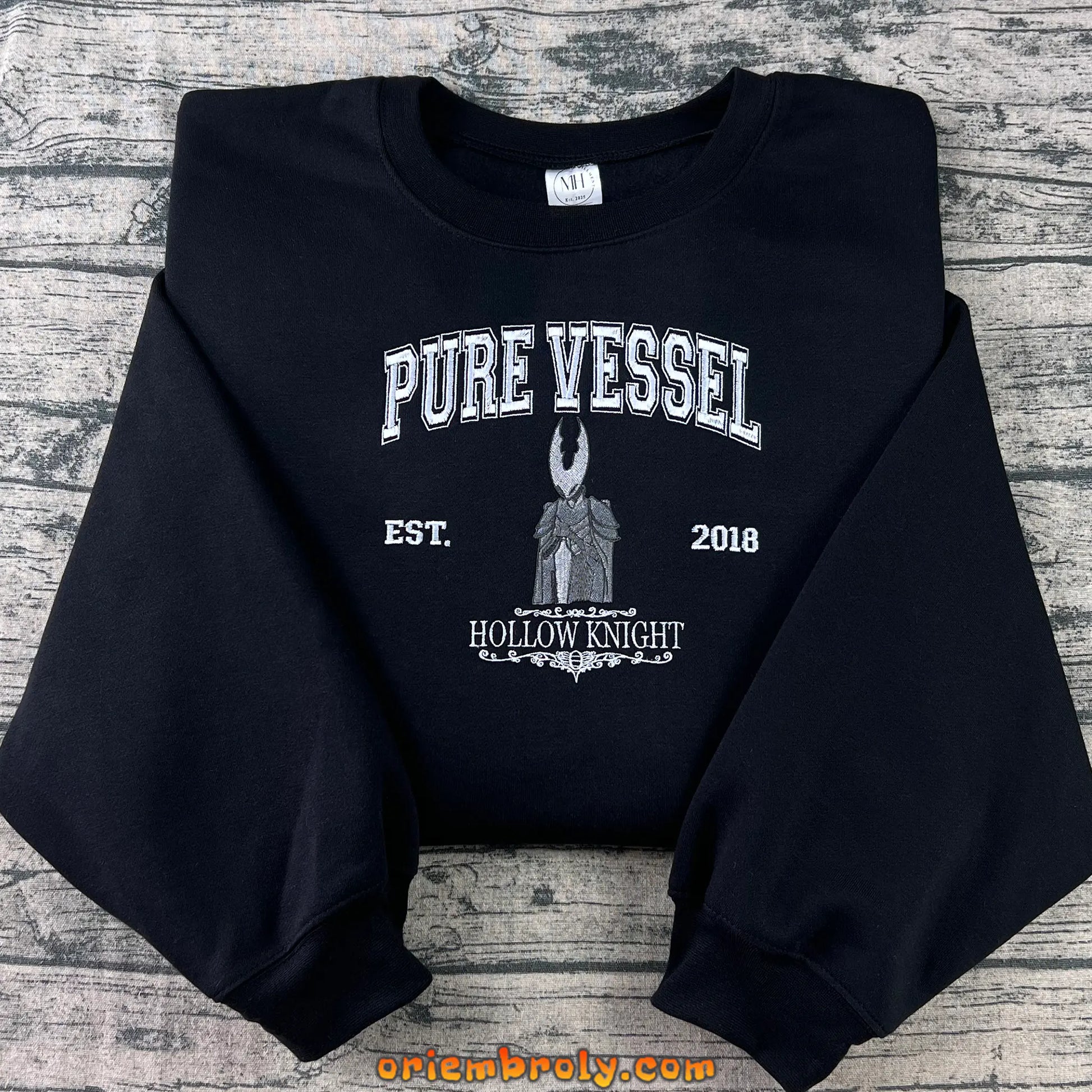 Pure Vessel-inspired embroidered crewneck front view