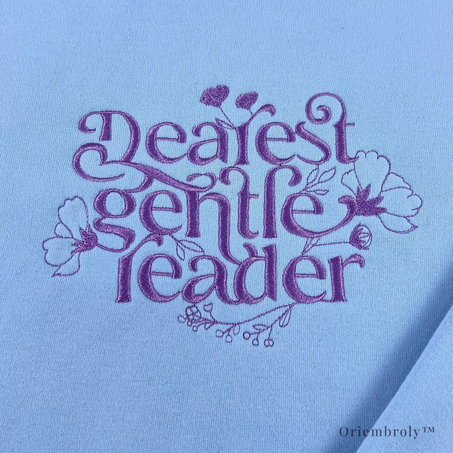 close-up script embroidery with floral vine details