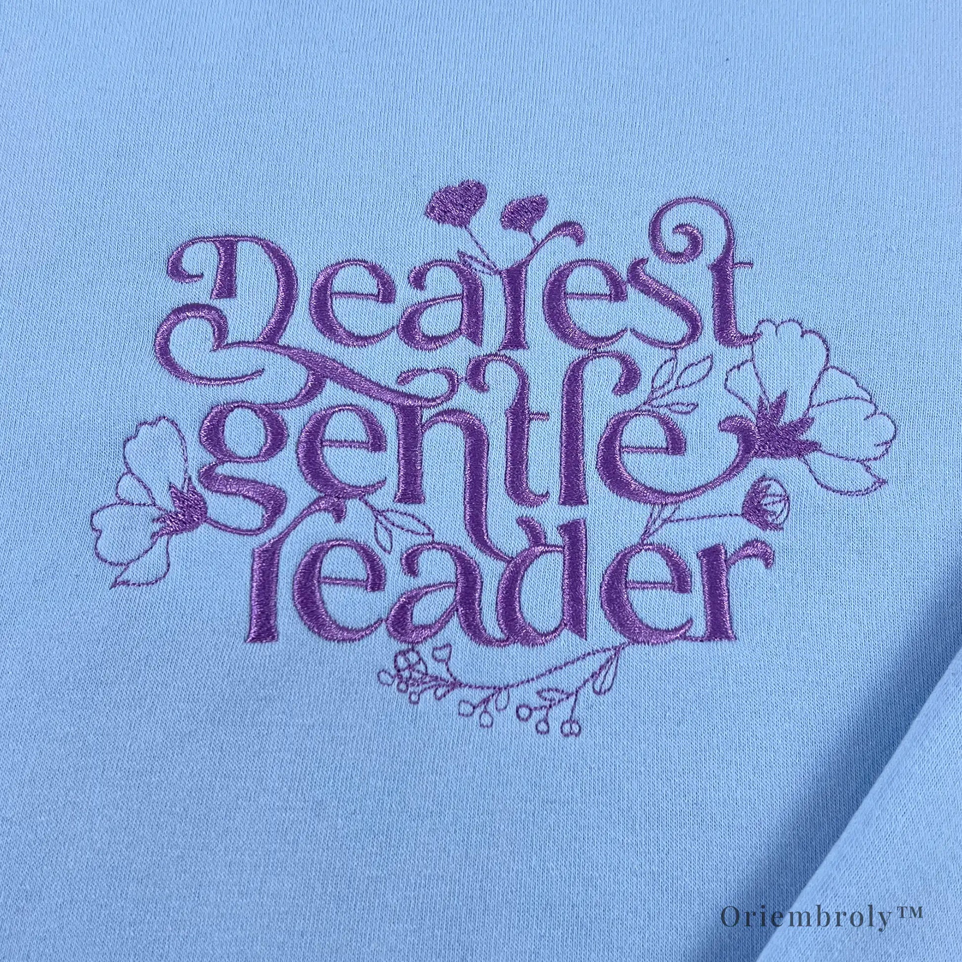 close-up script embroidery with floral vine details