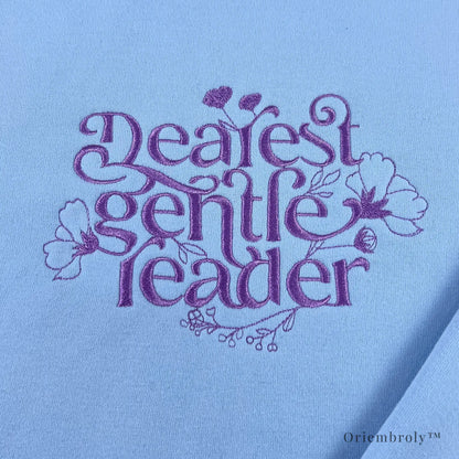 close-up script embroidery with floral vine details