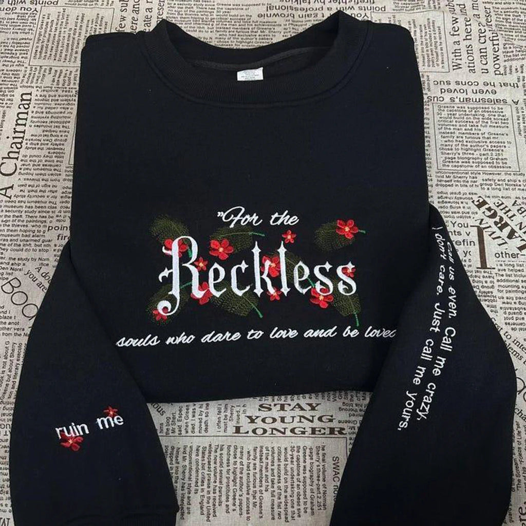 Reckless embroidered sweatshirt featuring Kai and Paedyn from Lauren Roberts Merch, a powerful book shirt for fantasy lovers.