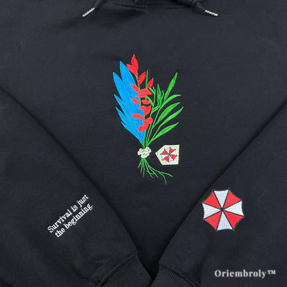red blue green herb embroidery detail on hoodie