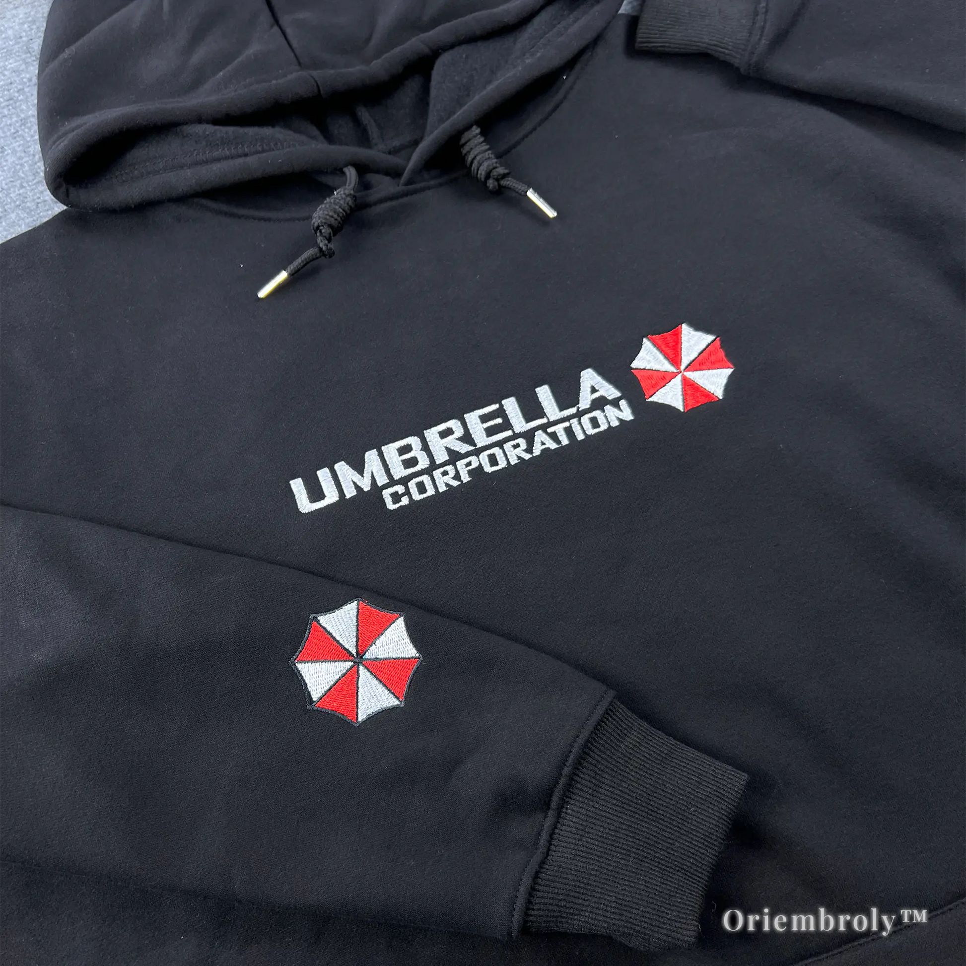 close up red and white emblem embroidery on hoodie