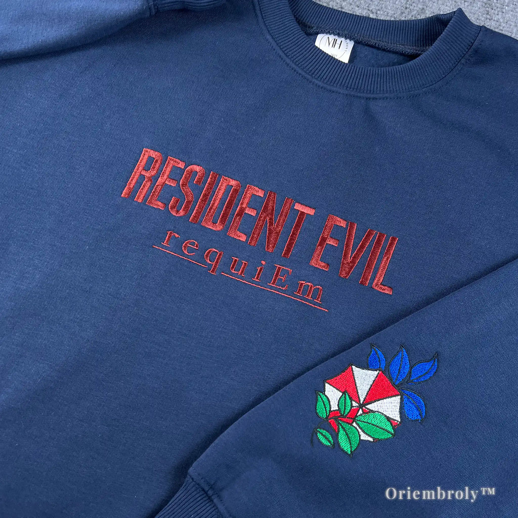 Unisex navy crewneck sweater featuring Resident Evil Biohazard red embroidery and sleeve patch.
