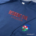 Unisex navy crewneck sweater featuring Resident Evil Biohazard red embroidery and sleeve patch.