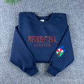 Navy Resident Evil Umbrella Corp embroidered sweatshirt with red lettering and sleeve logo.