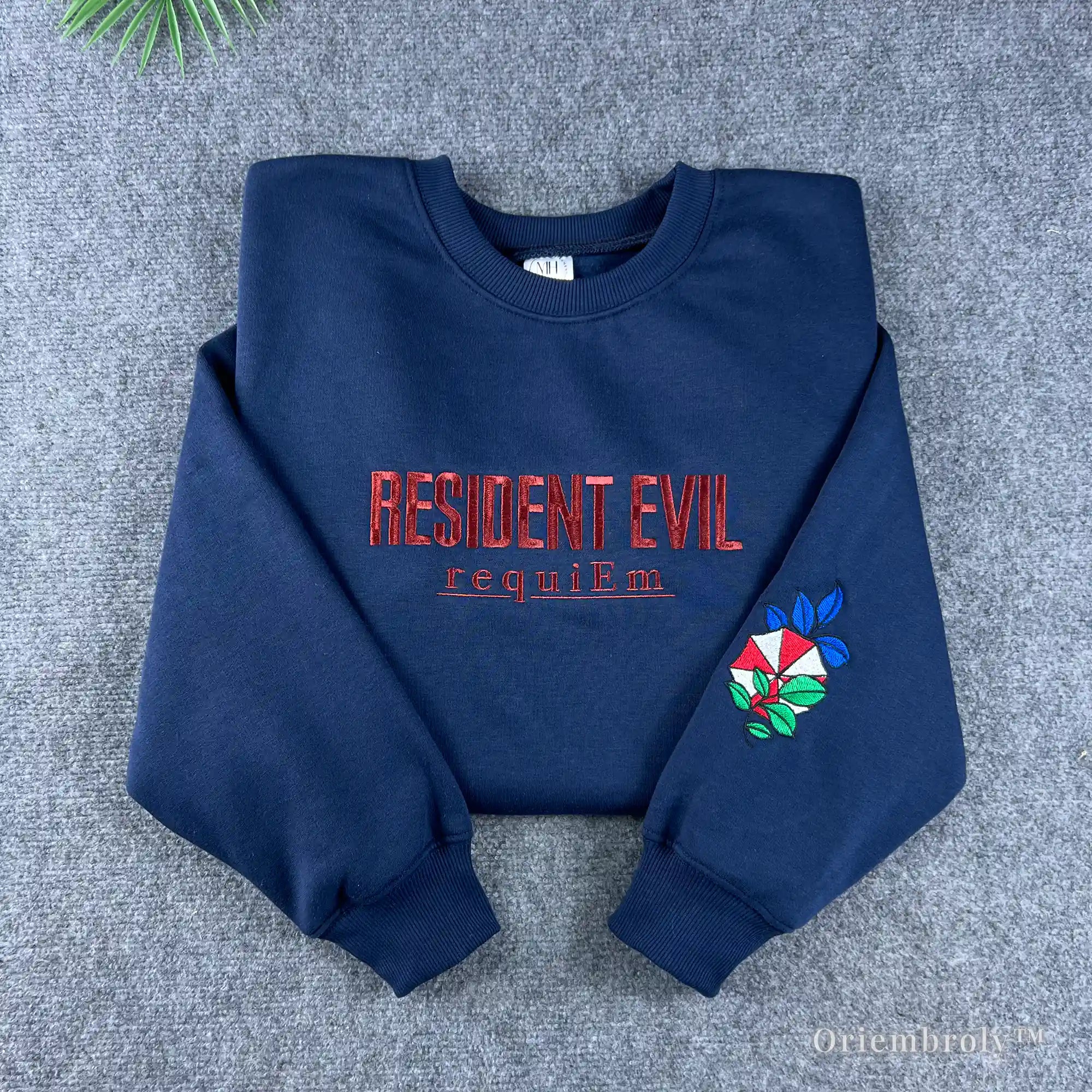 Navy Resident Evil Umbrella Corp embroidered sweatshirt with red lettering and sleeve logo.