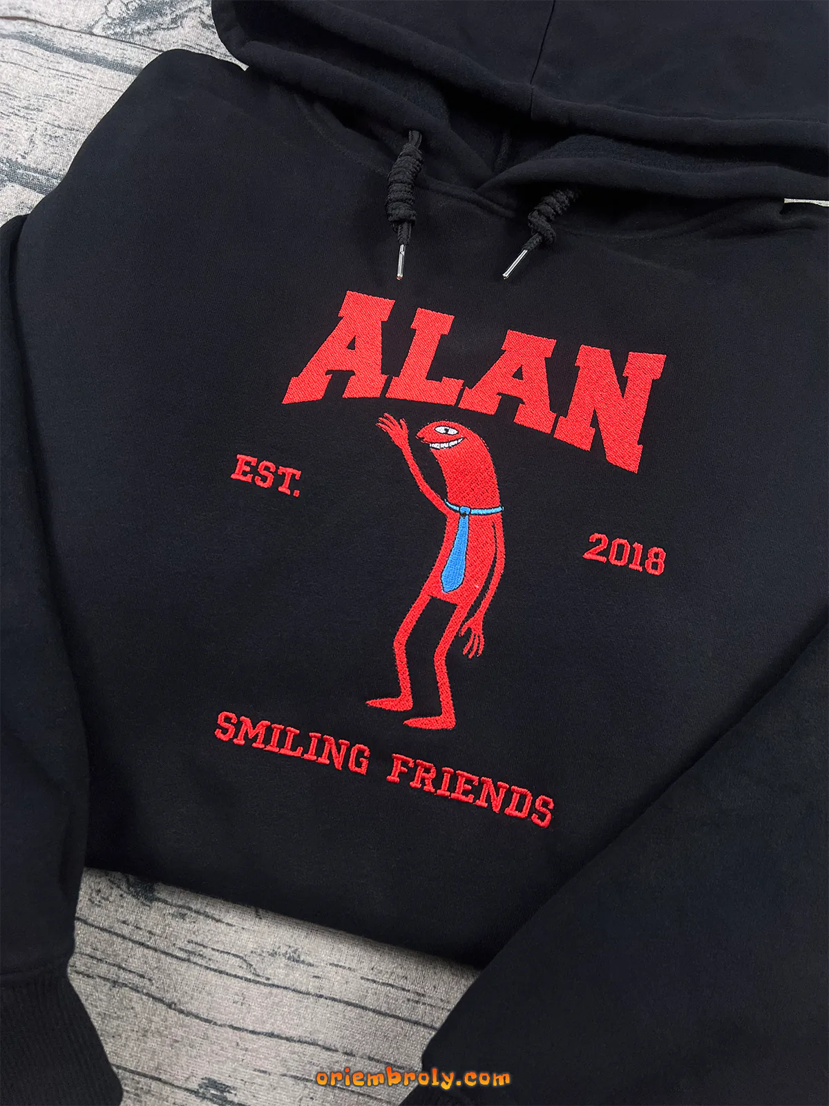 Retro cartoon style embroidered hoodie on black fabric