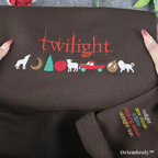 Embroidered design of 'Twilight' series elements on a brown fabric with 'Oriembroly' branding.