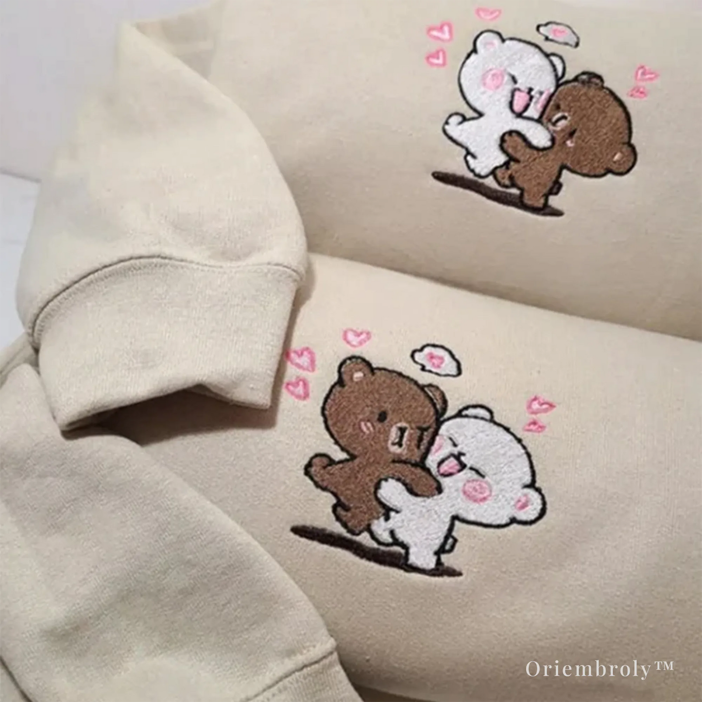 close-up satin stitch embroidery of bear couple hugging