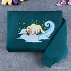 sky bison embroidered crewneck sweatshirt with flying cloud design