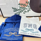 University hoodie with embroidered initials and bow
