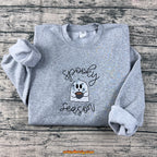 Front view of spooky season embroidered sweatshirt with cute ghost design