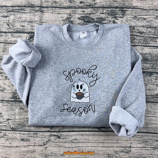 Front view of spooky season embroidered sweatshirt with cute ghost design