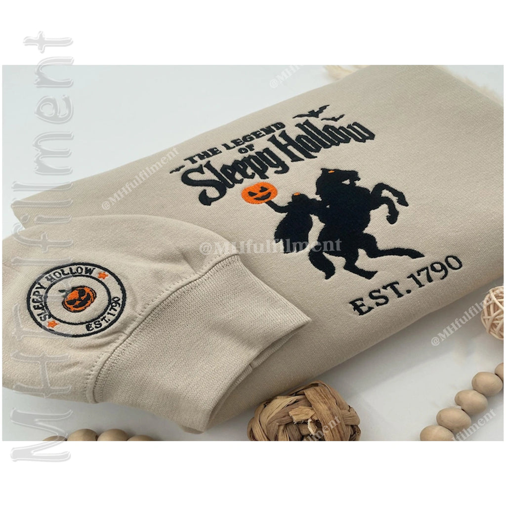 Beige sweatshirt with 'The Legend of Sleepy Hollow' design on a white background