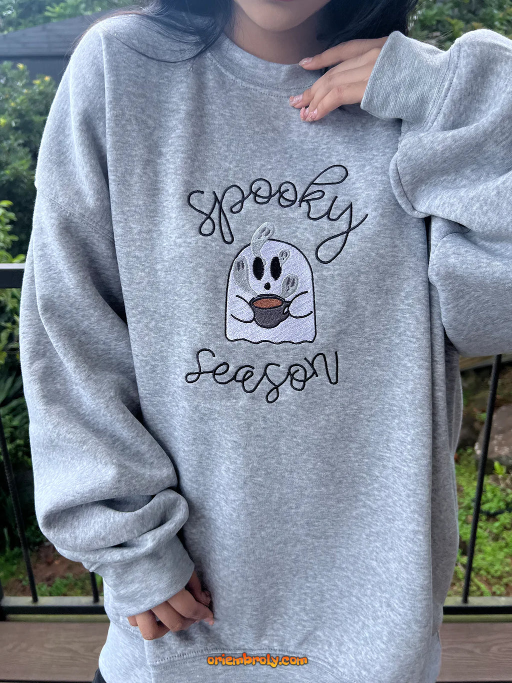 Cozy fall outfit with spooky season sweatshirt worn by model